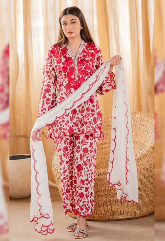 Three-piece unstitched heavy embroidered lawn suit with embroidered chiffon dupatta by Shaa Posh, featuring intricate embroidery details.