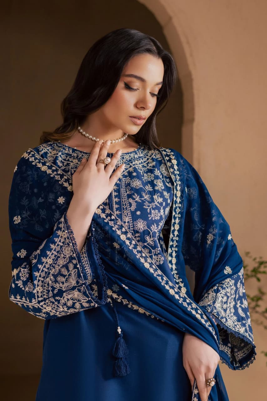 Fully embroidered unstitched lawn suit with matching embroidered bamber chiffon dupatta by Shaa Posh, featuring intricate embroidery details.