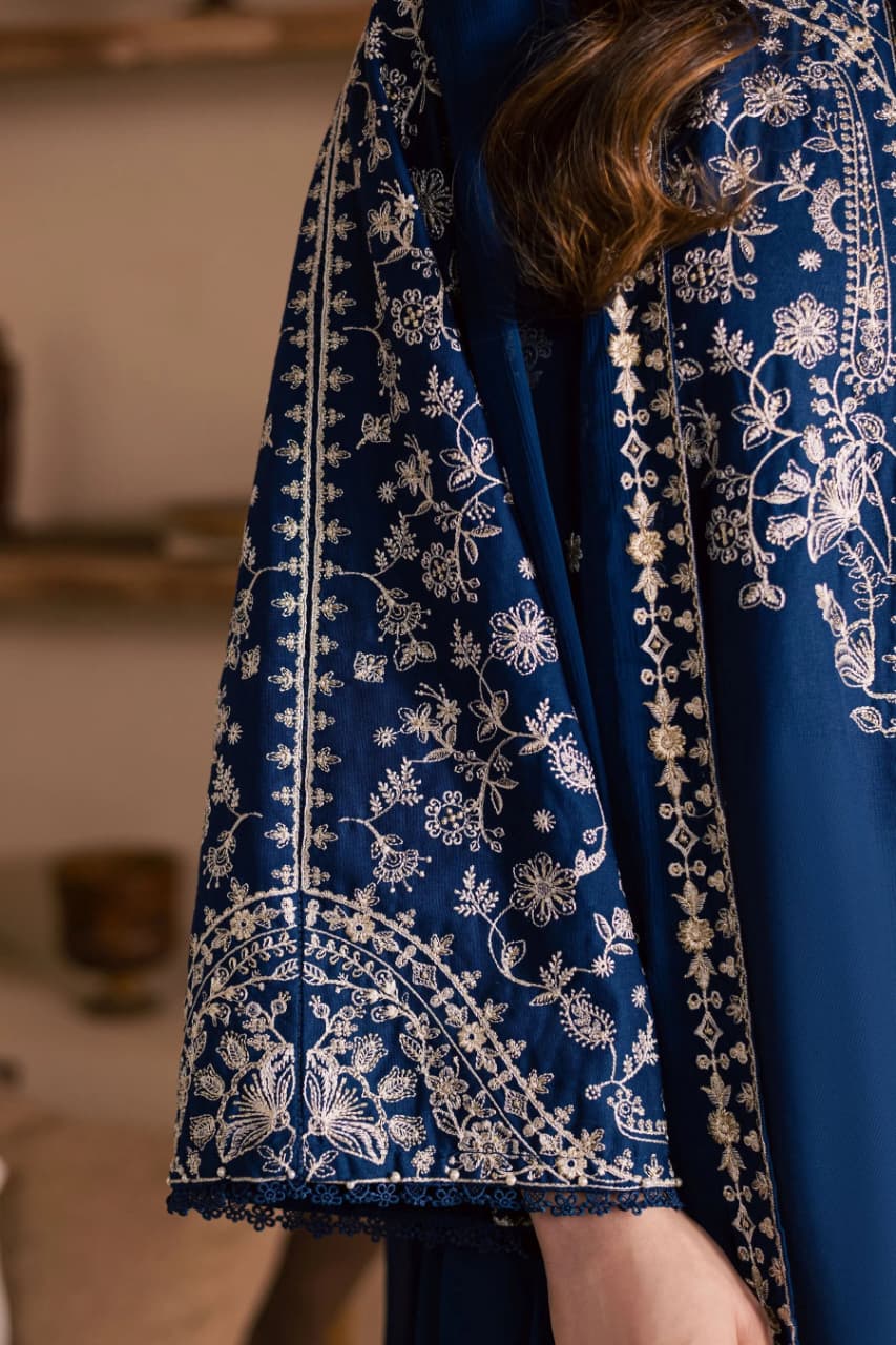 Unstitched fully embroidered lawn suit by Shaa Posh with matching embroidered chiffon dupatta, featuring intricate embroidery and vibrant fabric