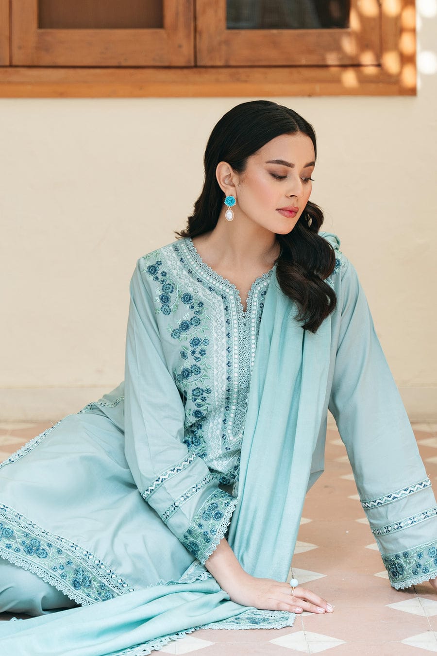 Three-piece unstitched embroidered lawn suit by Shaa Posh with a four-sided embroidered dupatta, featuring heavy floral embroidery.