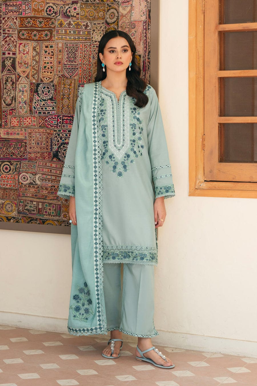 Unstitched Shaa Posh SP-2500 heavy embroidered lawn suit with matching four-sided embroidered dupatta displayed on a hanger.