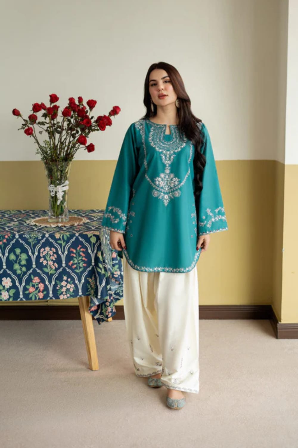Fully embroidered Shaa Posh SP-6.1 lawn two-piece trouser set displayed on a hanger with intricate embroidery details visible.